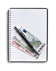 euro currency and pen on blank notebook