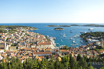 Naklejka premium Hvar, harbor of old Adriatic island town. panoramic view. Popula