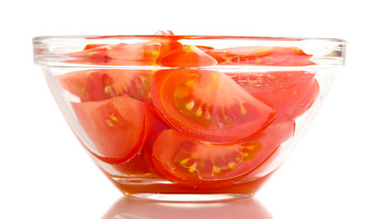 Diced tomatoes in glass bowl isolated on white
