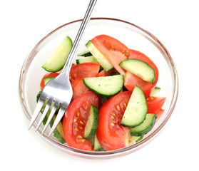 Fresh salad with tomatoes and cucumbers isolated on white