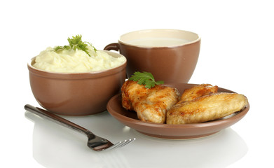 Mashed potato with parsley in the bowl and roasted chicken