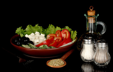 tasty greek salad isolated on black