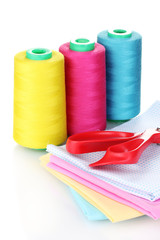 Sewing accessories and fabric isolated on white