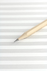 pencil on a blank staff paper