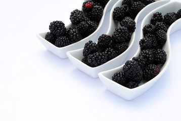 juicy blackberries into shaped dishes