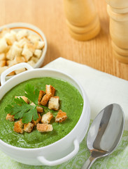 Cream soup with dried crusts on the table