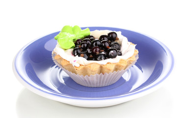 sweet cake with berries on saucer isolated on white