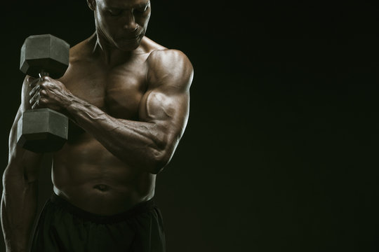 African American man weight lifting - Powered by Adobe