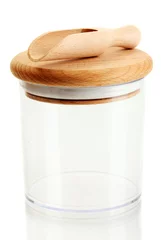 Foto op Plexiglas lege glazen pot voor specerijen met lepel geïsoleerd op wit © Africa Studio