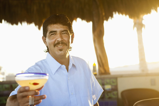 Bartender serving cocktail
