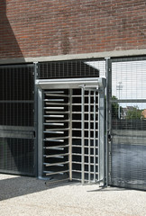 turnstile door to the input of a stadium.