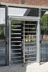 turnstile door to the input of a stadium.