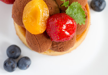 Fresh fruit tart with strawberries, blueberries and apricots