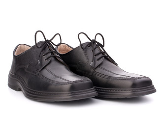 Black glossy man’s shoes with shoelaces