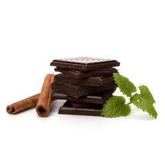 Chocolate bars stack and cinnamon sticks