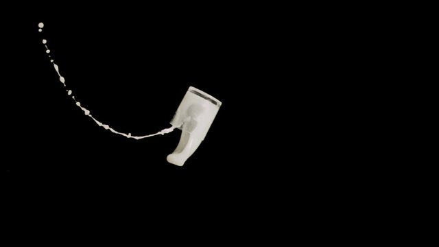 Glass of milk thrown in super slow motion
