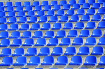 plastic blue seats on football stadium