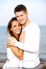 Lovely Young Couple Smiling while Posing