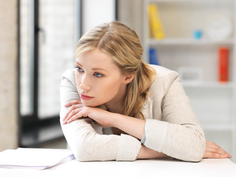 unhappy woman in office