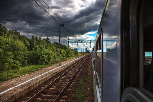 Fototapeta Dark rain clouds accompanying the train.