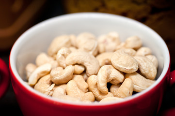 Handful of cashews in a cup
