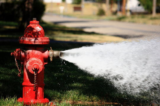 Open Fire Hydrant Spraying High Pressure Water
