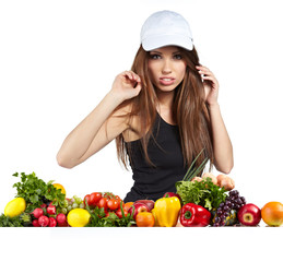 Young smiling woman with fruits and vegetables. Over white backg