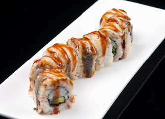closeup of a sushi rolls on a white plate