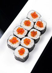 closeup of a sushi rolls on a white plate