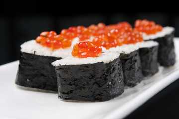 closeup of a sushi rolls on a white plate