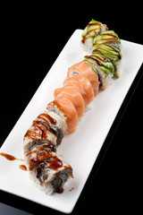 closeup of a sushi roll , japanese food , mixed set
