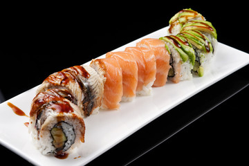 closeup of a sushi roll , japanese food , mixed set