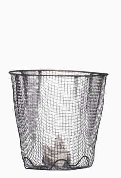 Crumpled paper in wastepaper basket