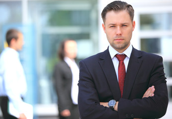Happy smart business man in office
