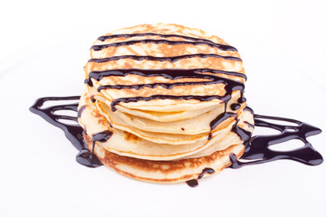 stack of pancakes with chocolate sauce