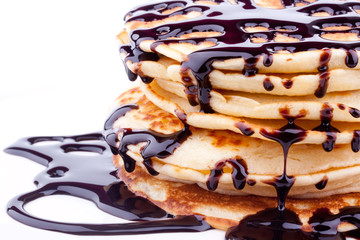 stack of pancakes with chocolate sauce