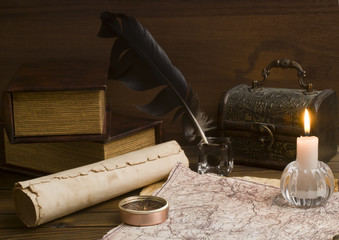 old papers and books on a wooden table