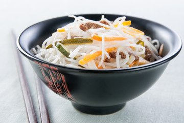 rice noodles with vegetables, mushrooms and meat