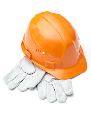Orange hard hat on white gloves, isolated on white