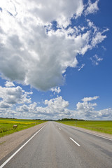 empty road and blue sky with white clouds
