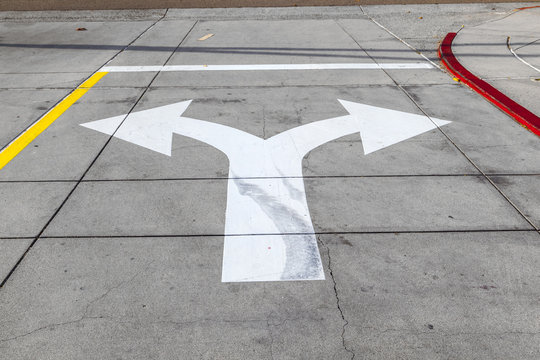 arrows and lines on the asphalt