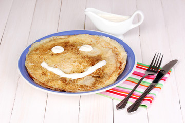 Stack of tasty pancakes on wooden background