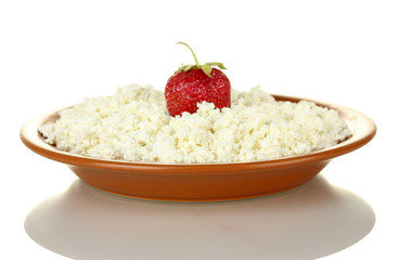 Cottage cheese with strawberry in a plate isolated on white