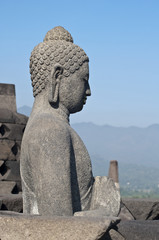 Buddha statue. Mountain on background. Borobudur. Java. Indonesi