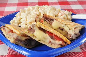 Close up of a roast beef panini on flatbread