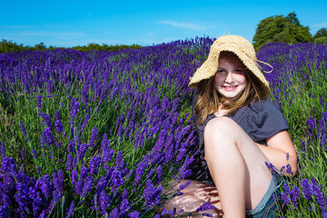 Young girl in a purple field of lavender