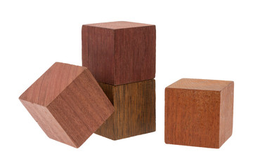 Several old cubes of wood, used by children for building