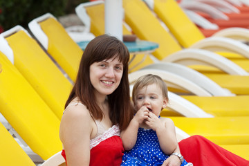 Fototapeta na wymiar happy mother with toddler at resort