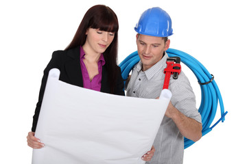 Co-workers watching a blueprint