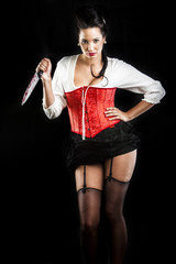 attractive brunette woman with bloody knife